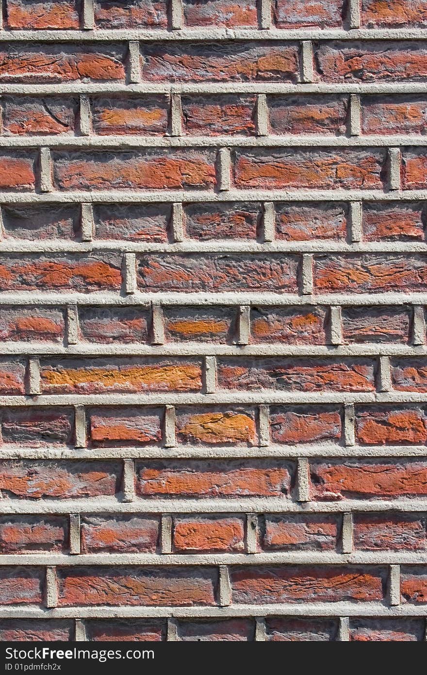 Rough brick wall facade with mortar standing out from the brick