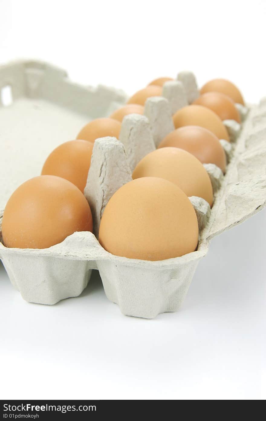 Free range eggs isolated against a white background