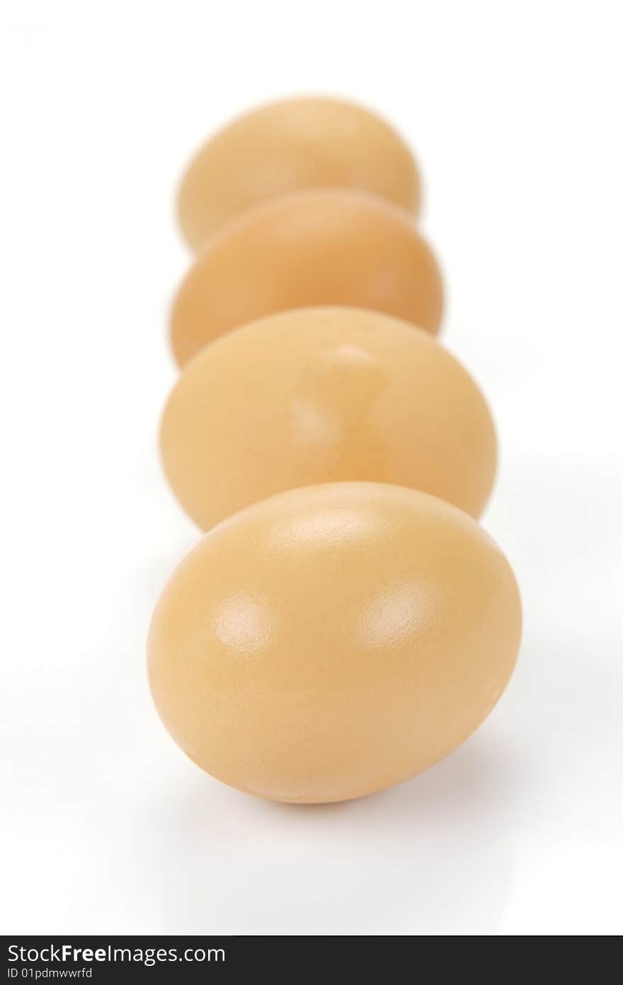 Free range eggs isolated against a white background