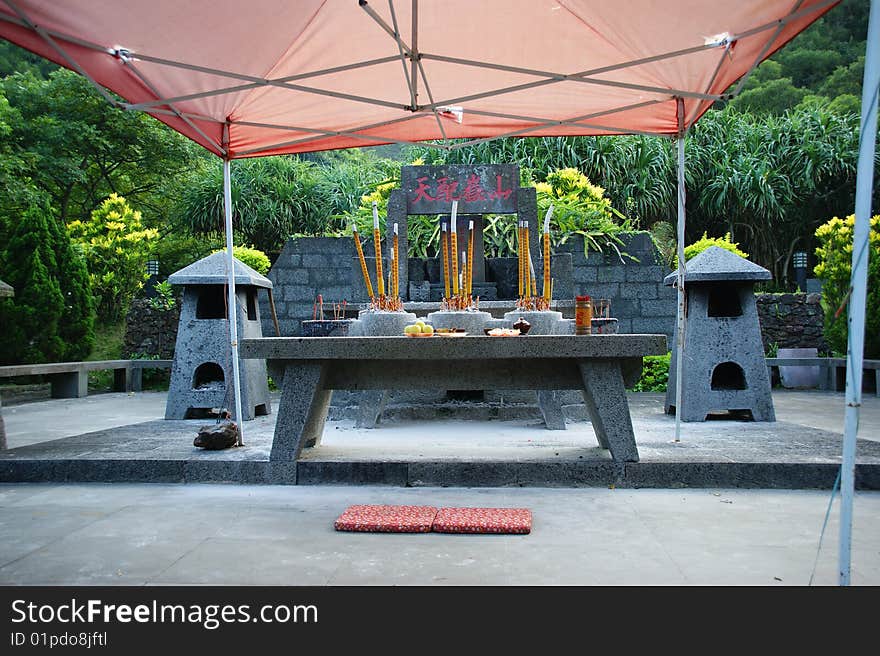 Place for prayers with gift on stone table. Place for prayers with gift on stone table