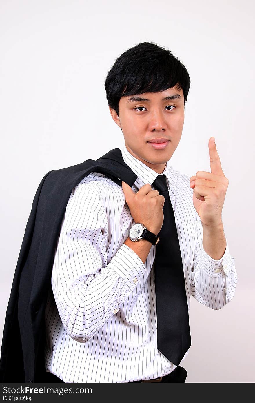 Young Asian Business man indicating that he is at the top. Young Asian Business man indicating that he is at the top.