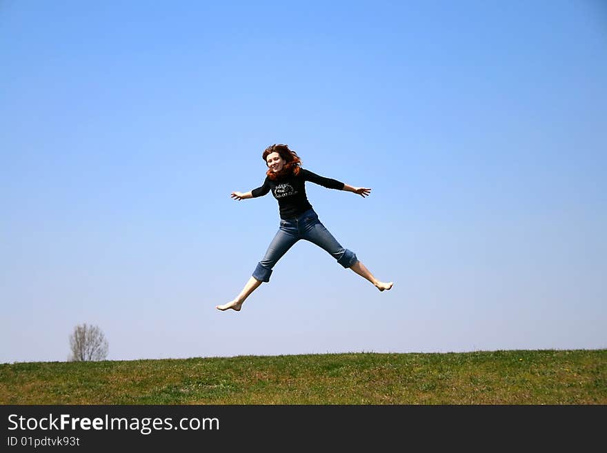 The girl taken in a jump like hanging in the air. The girl taken in a jump like hanging in the air