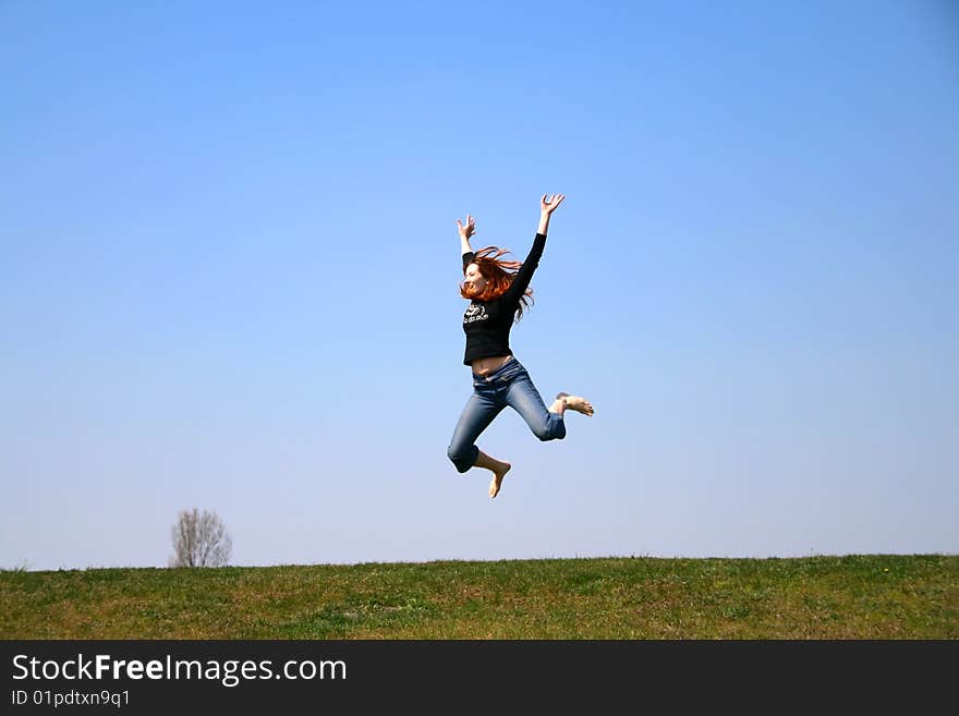 The girl taken in a jump like hanging in the air. The girl taken in a jump like hanging in the air