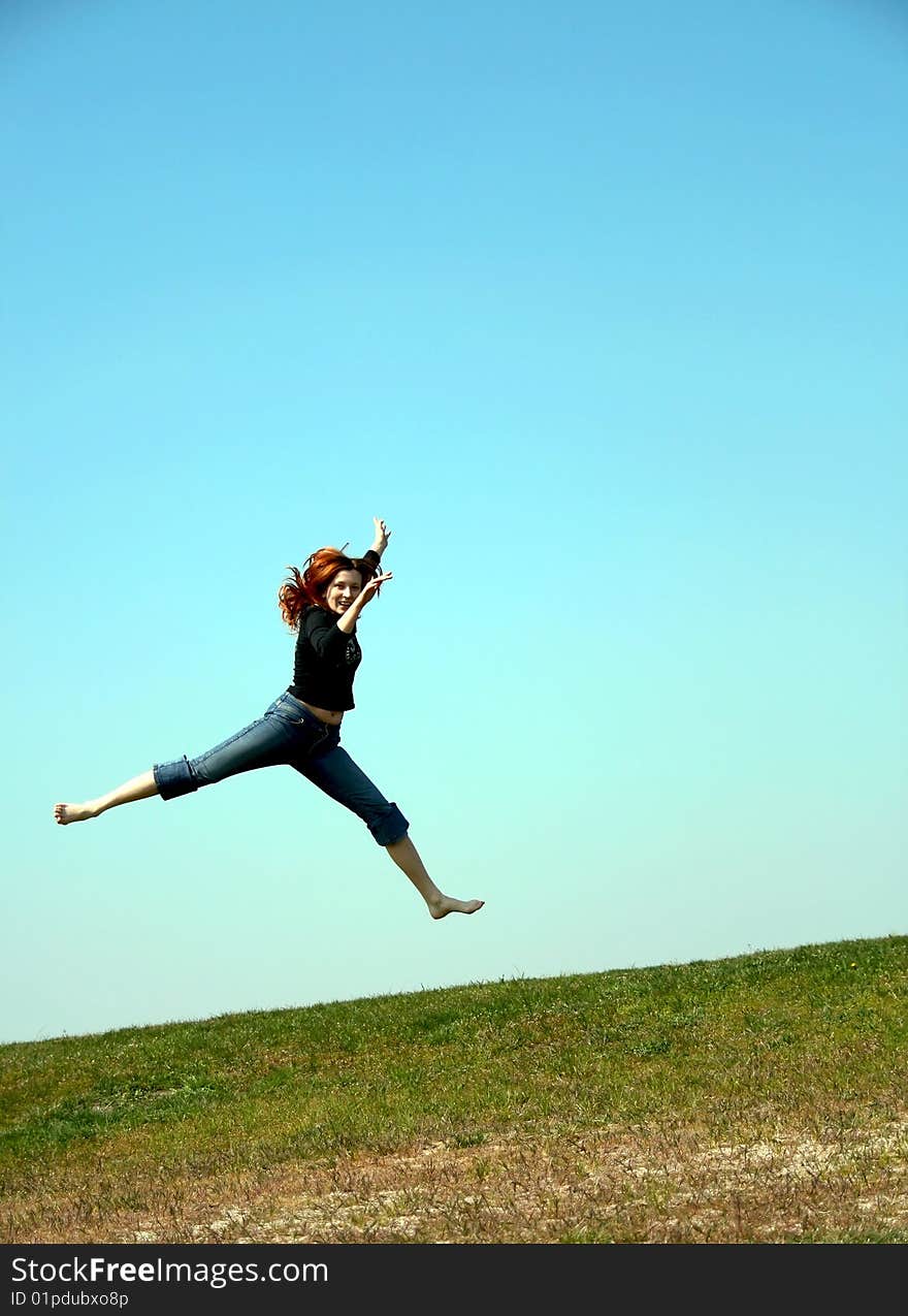 The girl taken in a jump like hanging in the air. The girl taken in a jump like hanging in the air