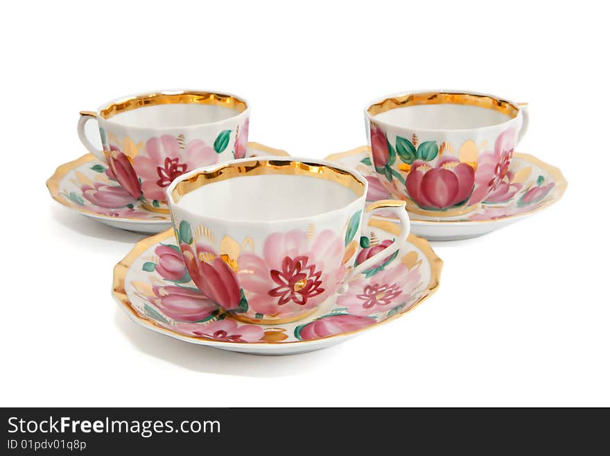 Three tea cups with saucers