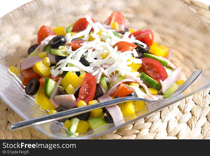 Vegetable salad with cheese and ham. Vegetable salad with cheese and ham