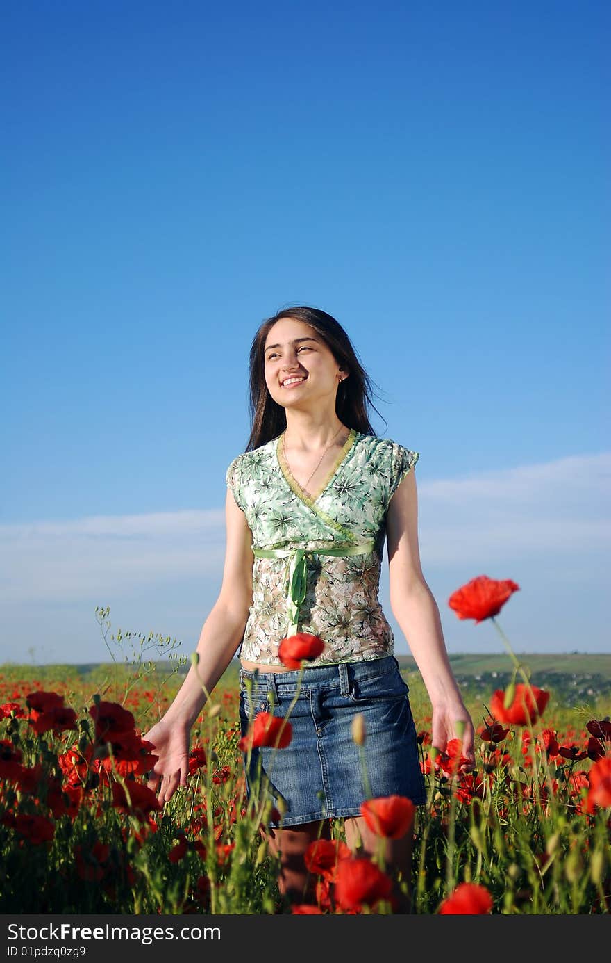 Girl On A Red Poppies Field