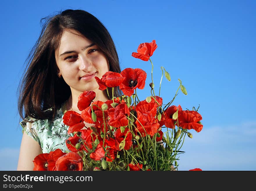 Girl On A Red Poppies Field