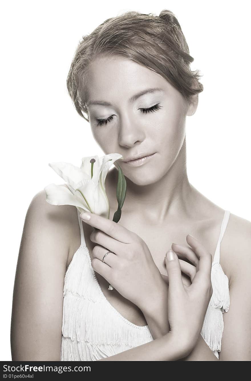 Romantic portrait of young woman whith white lilly