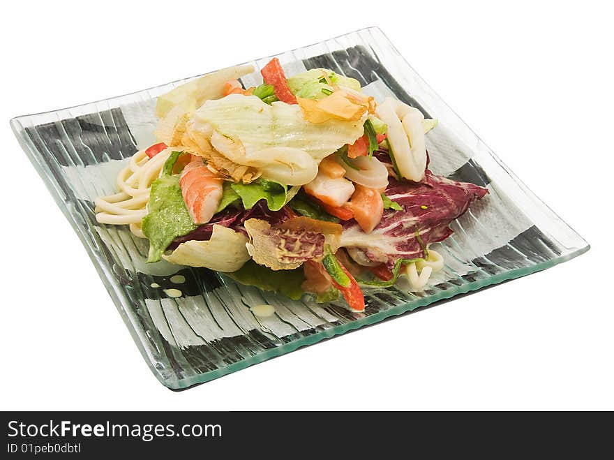 Plate with salad with squids on white. Plate with salad with squids on white