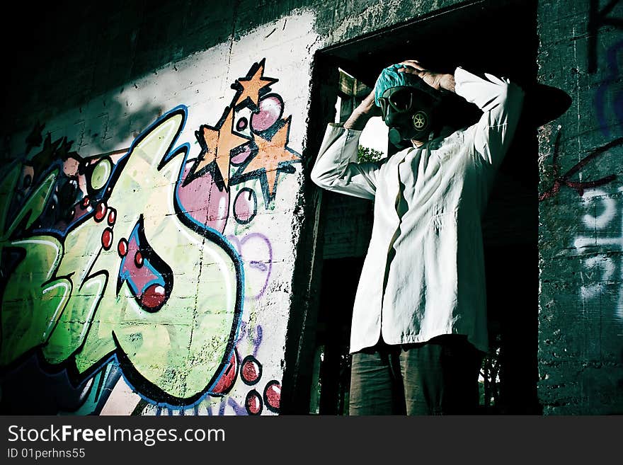 mad scientist in an abandoned warehouse, holds the head