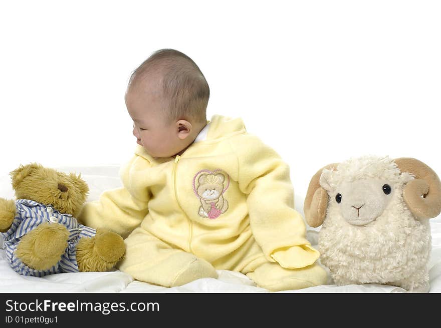 Baby with bear toys and sheep. Baby with bear toys and sheep