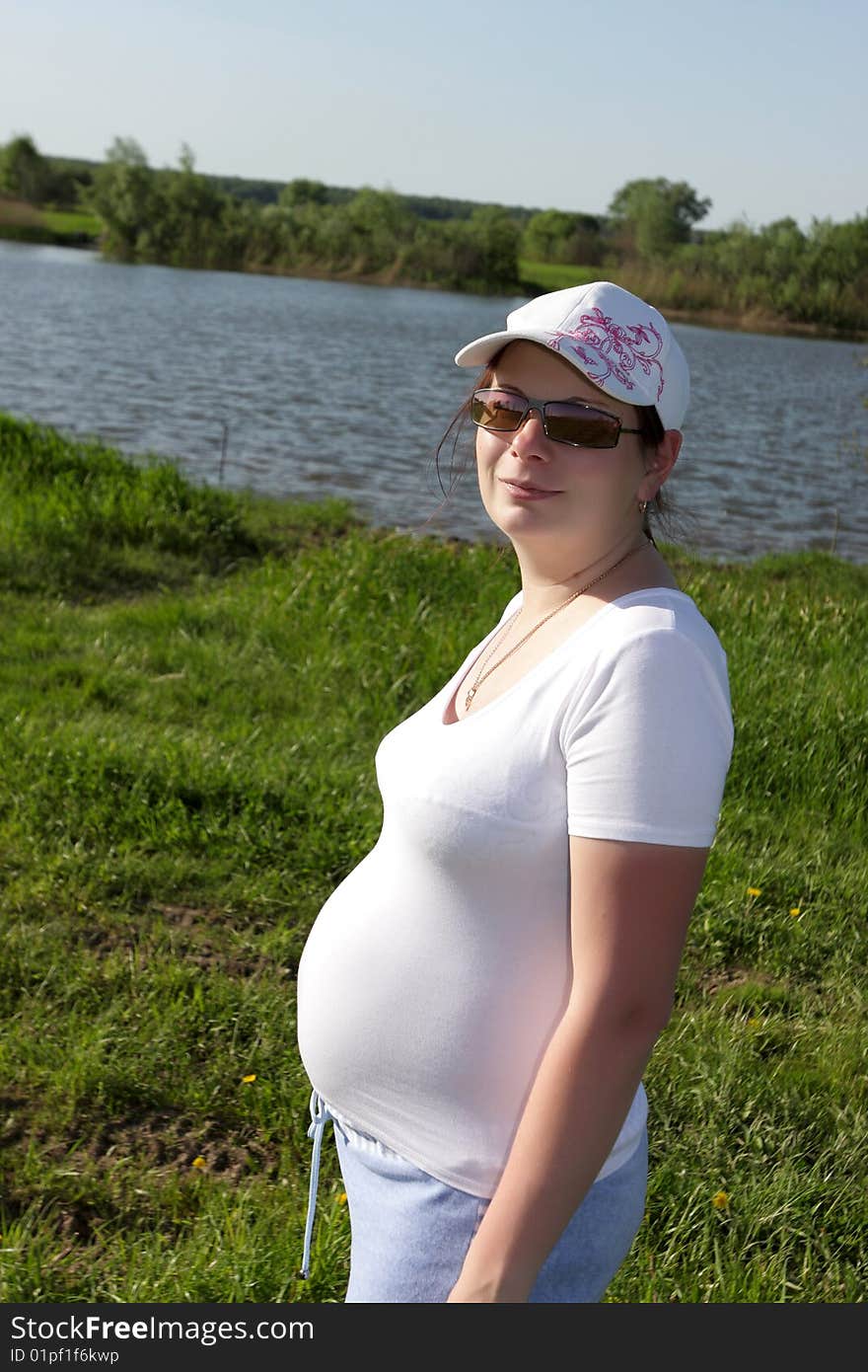 Portrait of a expectant mother on the riverside