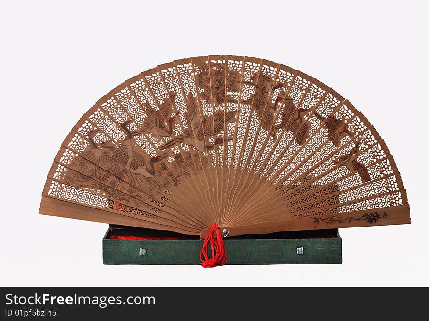 Wooden Chinese patterned fan isolated on white background