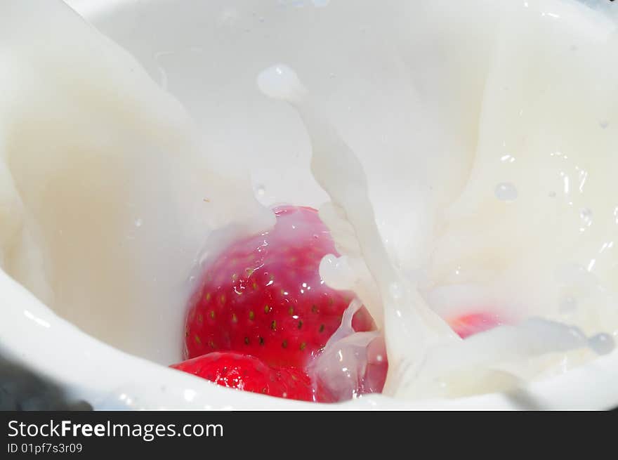 Strawberry splashing in milk for breakfast