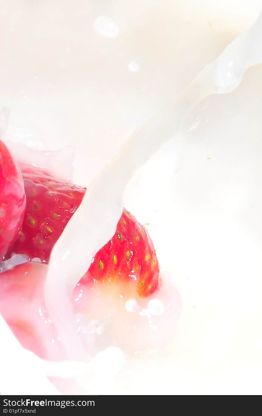 Strawberry splashing in milk for breakfast