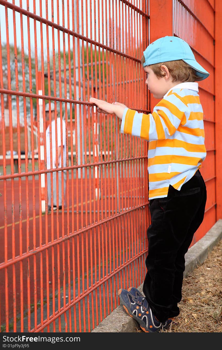 Little boy watching a football. Little boy watching a football.