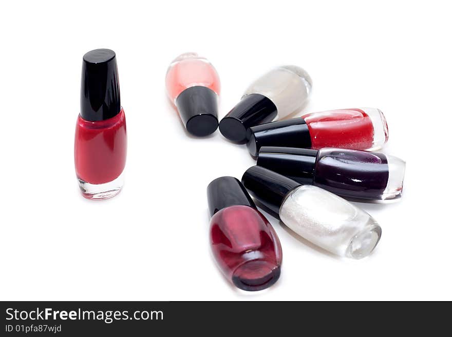 Vials colour varnish nailwaer, make-up insulated on white background