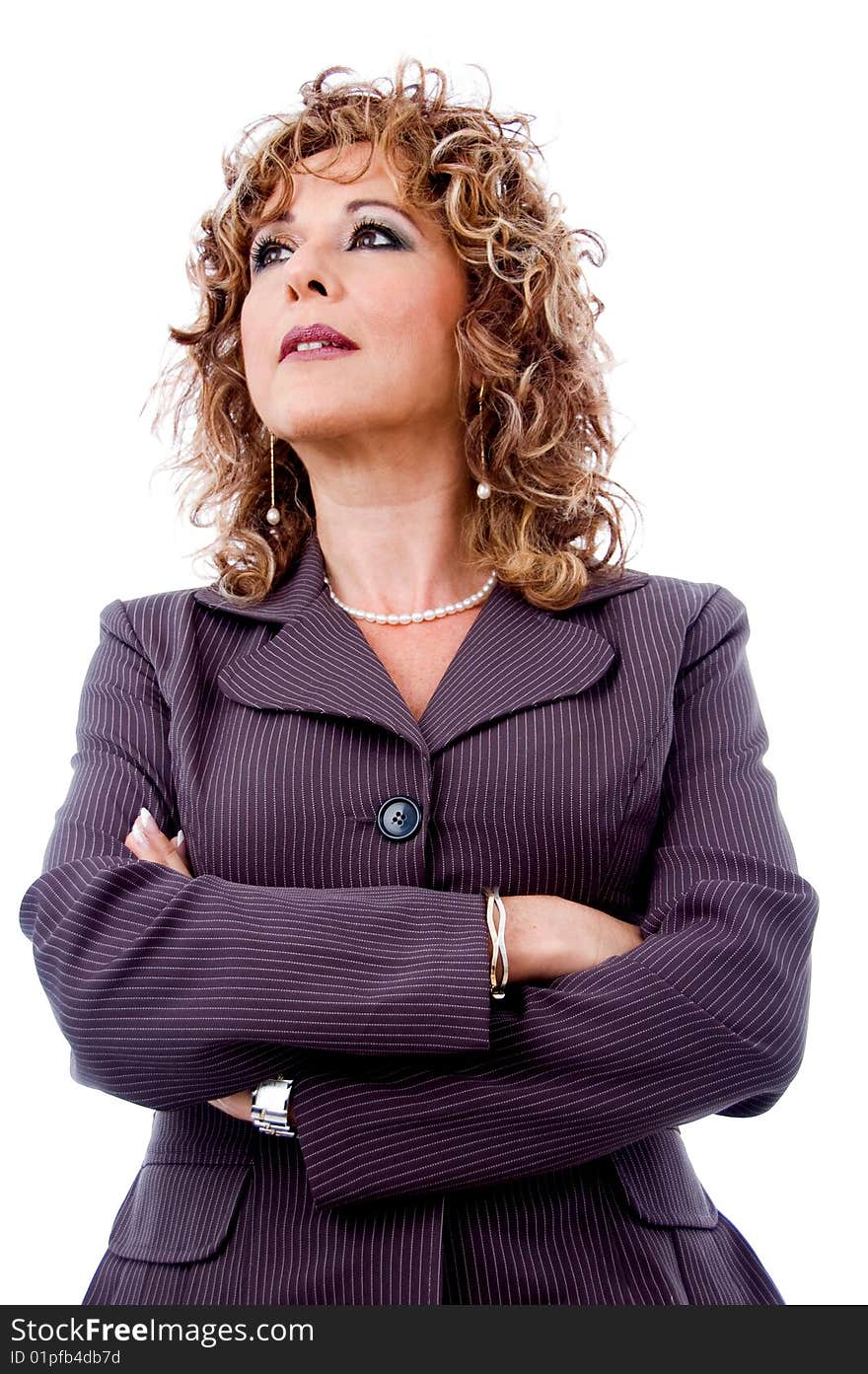 Successful business woman standing with folded arms