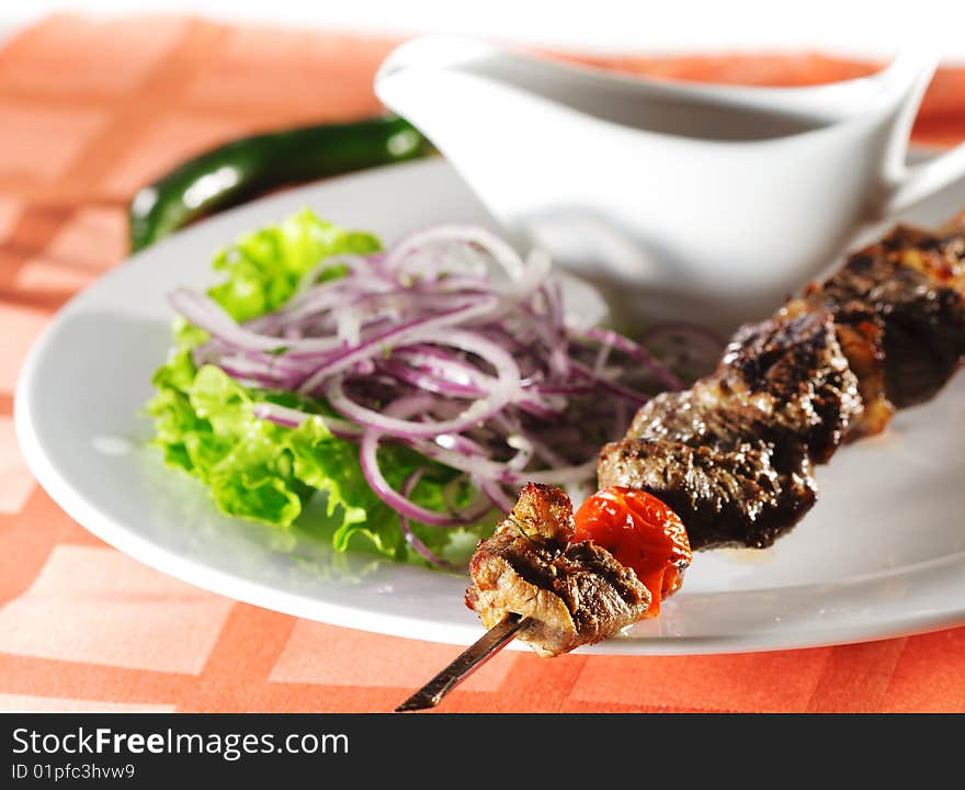 Hot Meat Dish - Grilled Lamb with Onions Salad and Sauce. Hot Meat Dish - Grilled Lamb with Onions Salad and Sauce