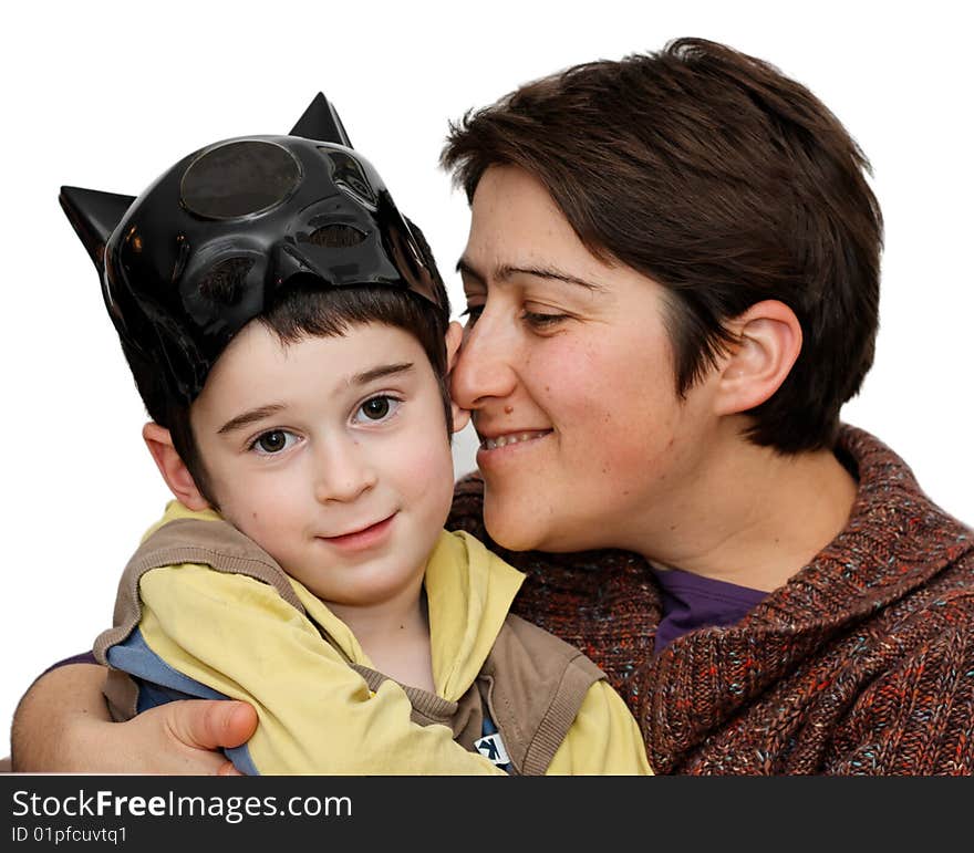 Mother embraces five year son who wears a mask on his head isolated. Mother embraces five year son who wears a mask on his head isolated