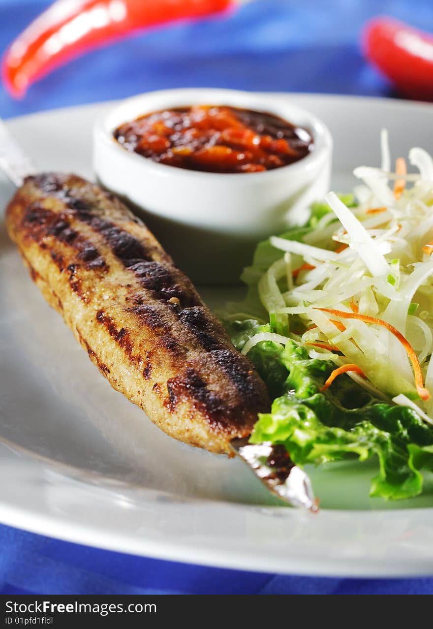 Hot Meat Dishes - Grilled Meat with Red Chile Sauce and Salad