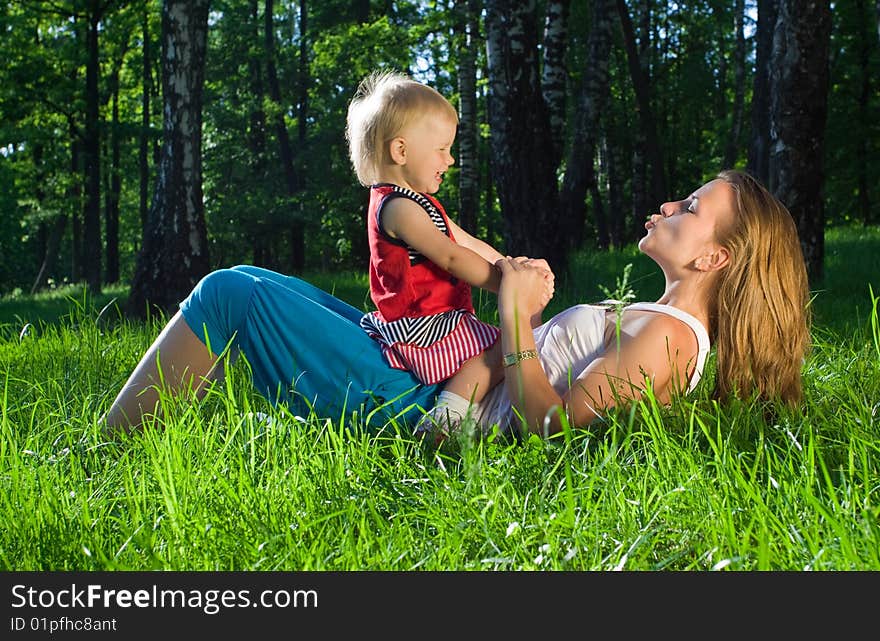 Young mother playing with  daughter