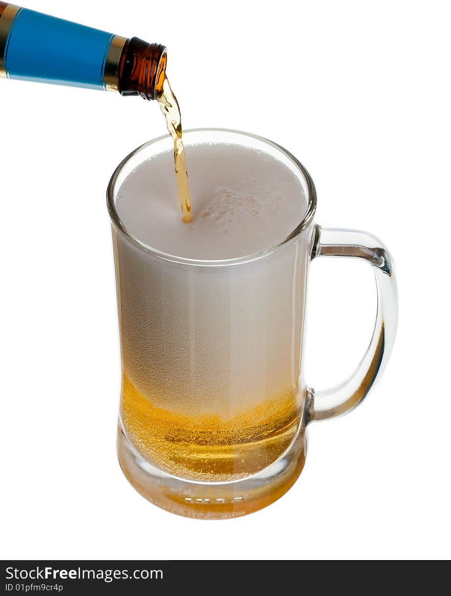 Glass of beer close-up with bottle isolated on white background