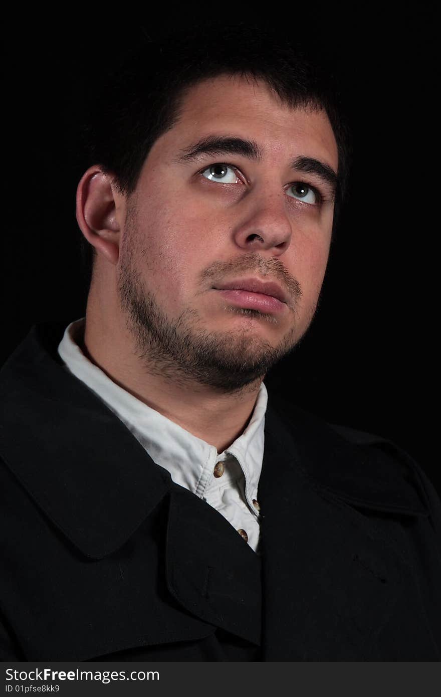 Male in thought, portrait isolated on black background. Male in thought, portrait isolated on black background