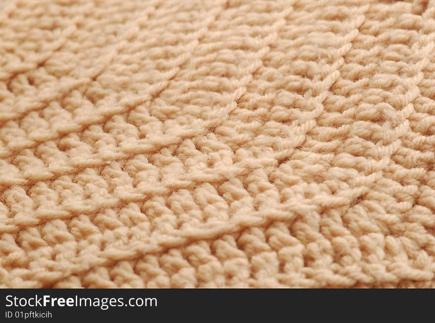 Close up of beige knit pattern.