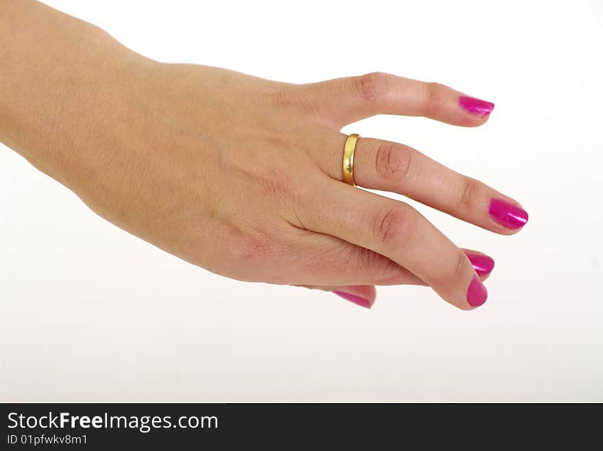 Womans hand with painted fingernails fingers crossed wearing a weding ring