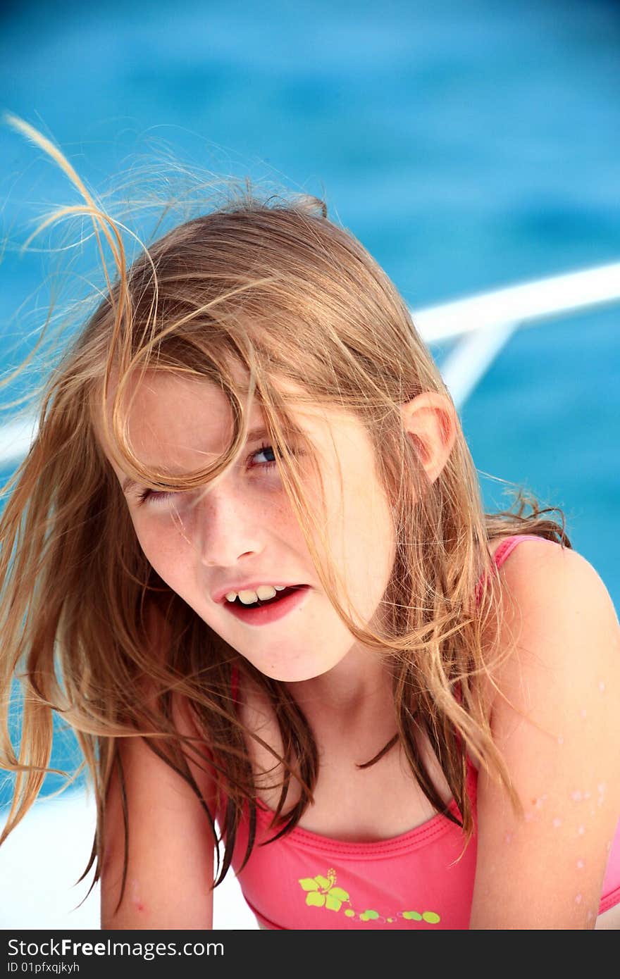 Teenage girl in pink swimsuit