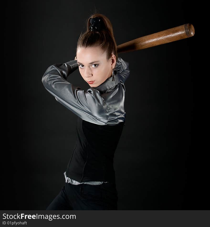 Young girl prepares to strike by baseball bat. Young girl prepares to strike by baseball bat