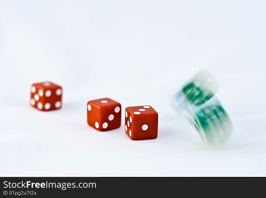 Five dice (red and green) rolling. Five dice (red and green) rolling