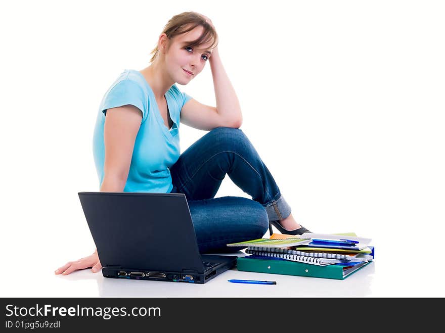 Teenager schoolgirl with laptop on white background