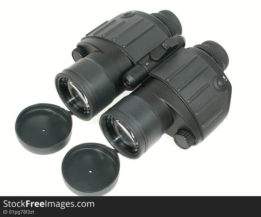 Binoculars. Field-glass with open lids isolated on white.