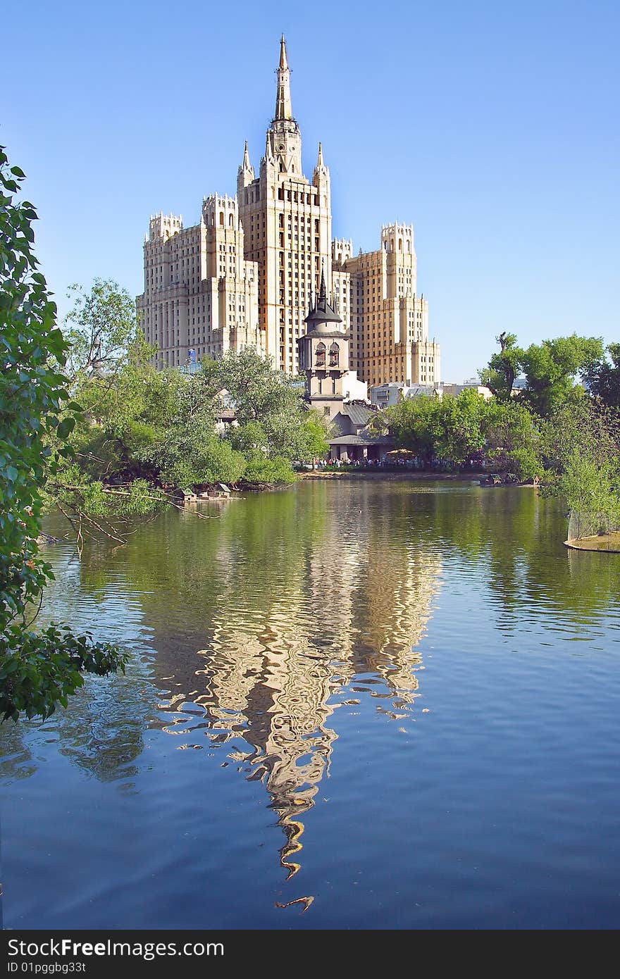 High building reflects under the zoo lake