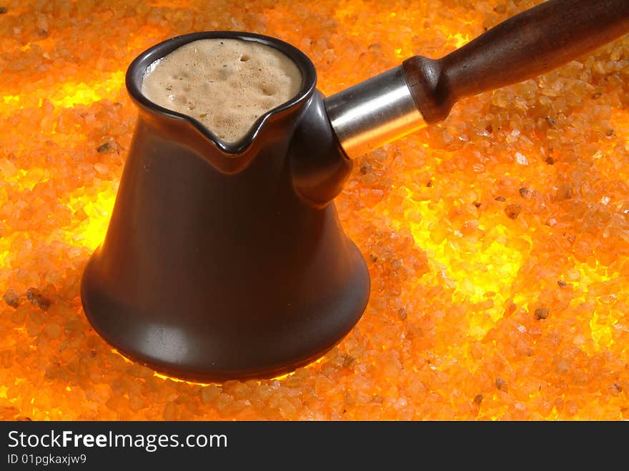 Coffee pot on the hot sand. Coffee pot on the hot sand