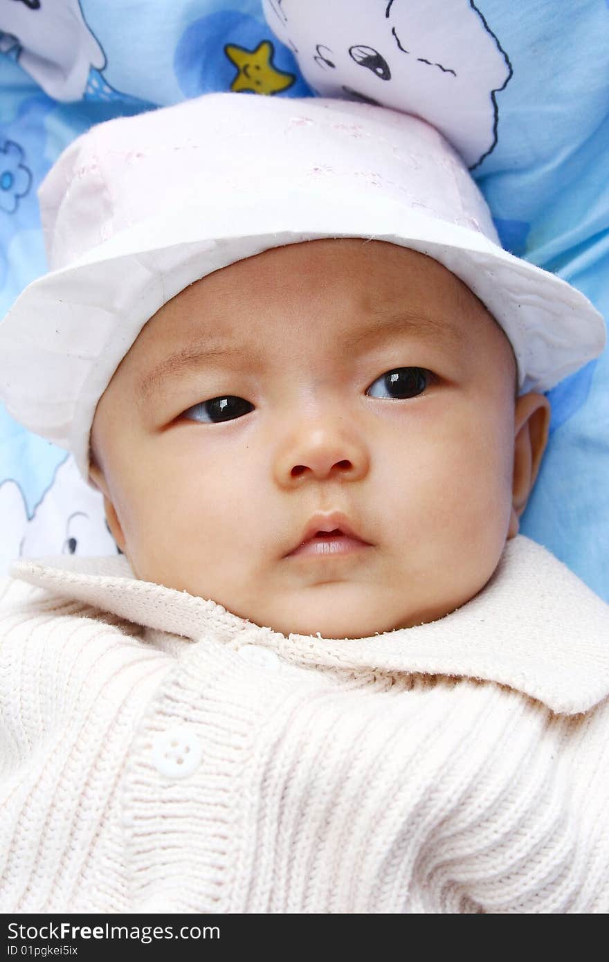 It is a cute chinese baby, isolated. he is 5 months. It is a cute chinese baby, isolated. he is 5 months