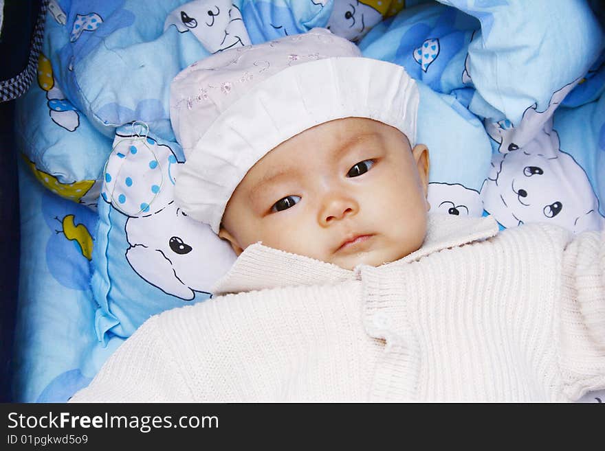 It is a cute chinese baby, isolated. he is 5 months. It is a cute chinese baby, isolated. he is 5 months