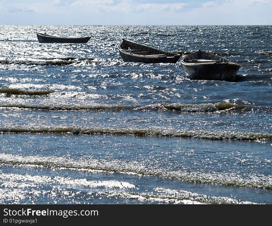 Small fishing boats on the sea. Small fishing boats on the sea.