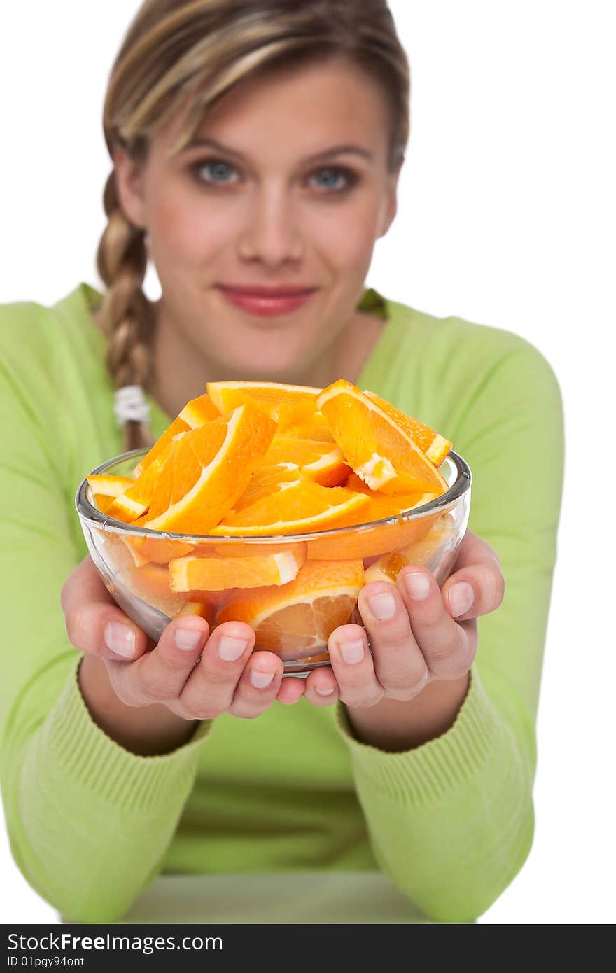 Woman with oranges on white background, focus on orange. Woman with oranges on white background, focus on orange