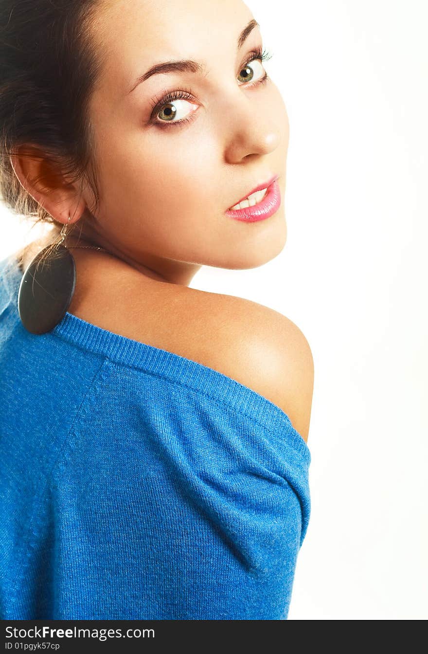 Portrait of a beautiful young brunette woman against white background