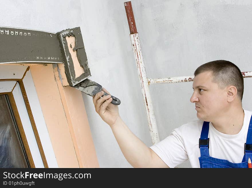 Plasterer inflicts mortar on architectural element