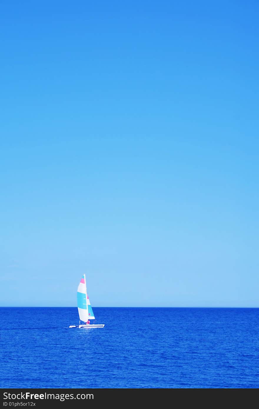 Sailboat at an open sea. Sailboat at an open sea.