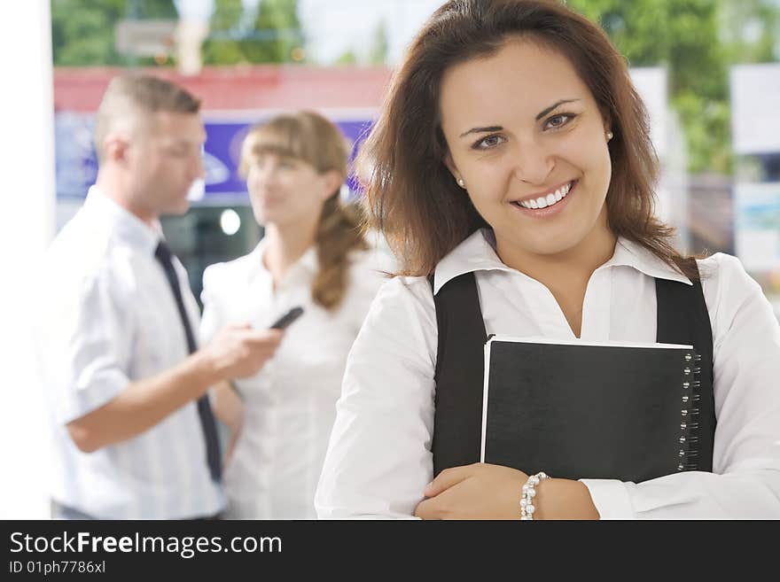 Portrait of young pretty woman in business environment. Portrait of young pretty woman in business environment