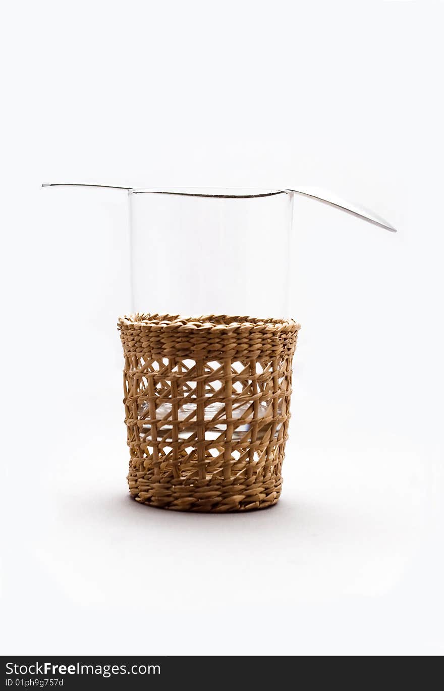 A glass in a wickery basket