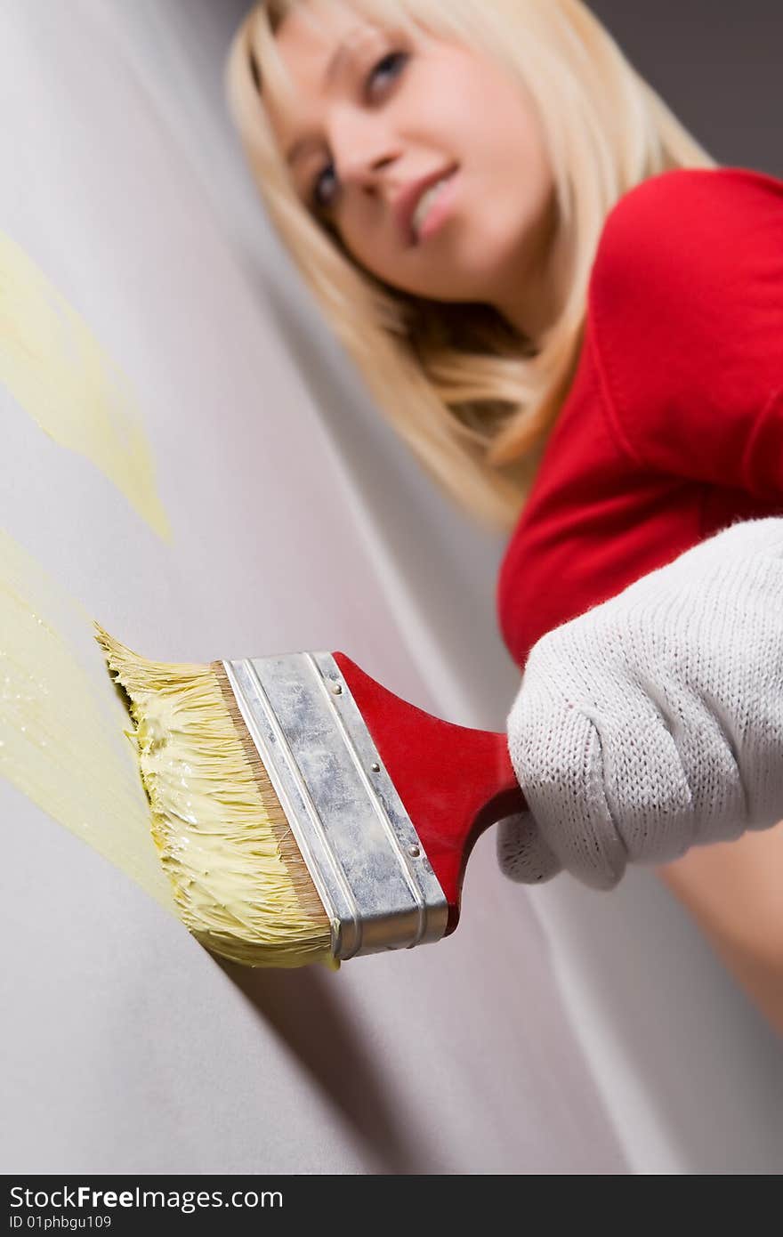 Young beautiful girl with paint brush