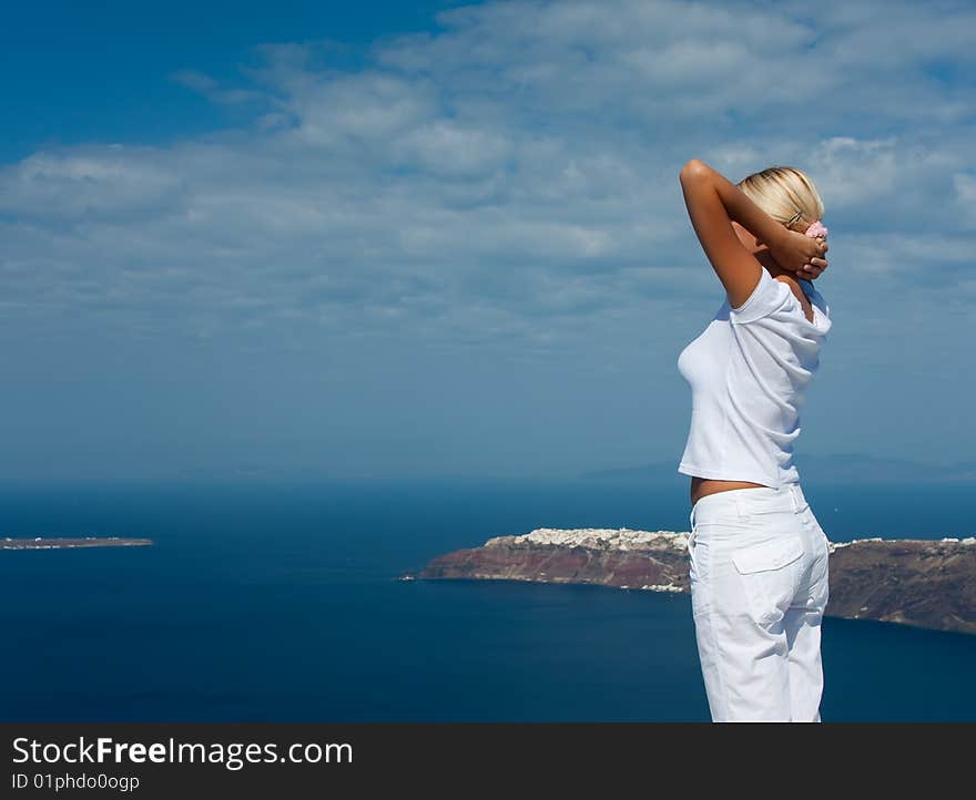 Young girl resting against the blue sky.