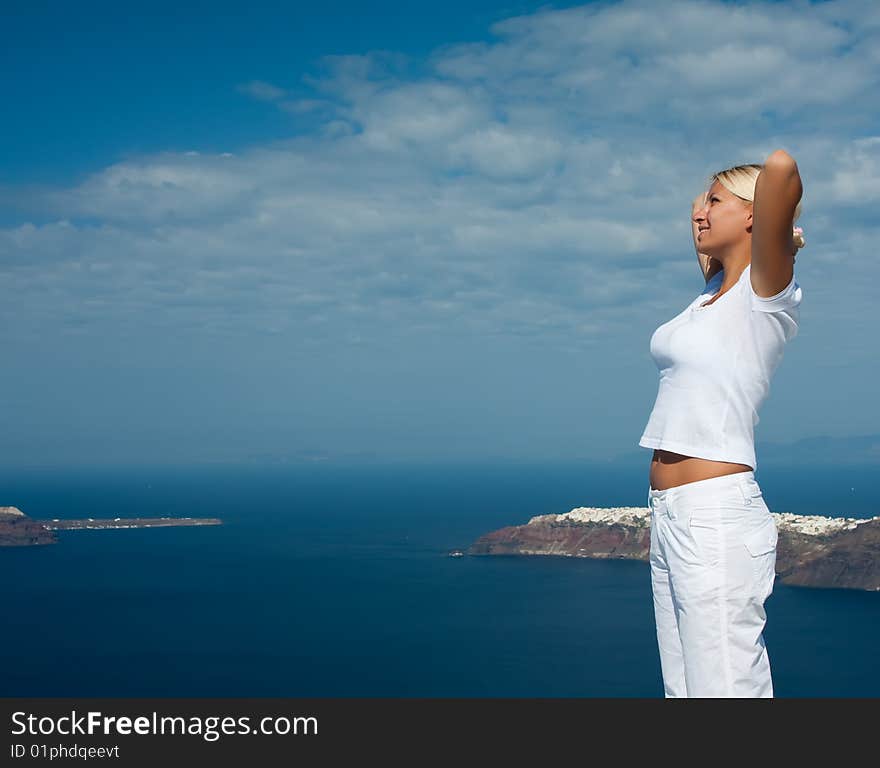 Young girl resting against the blue sky.